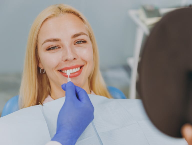 Patient having a dental veneer fitted